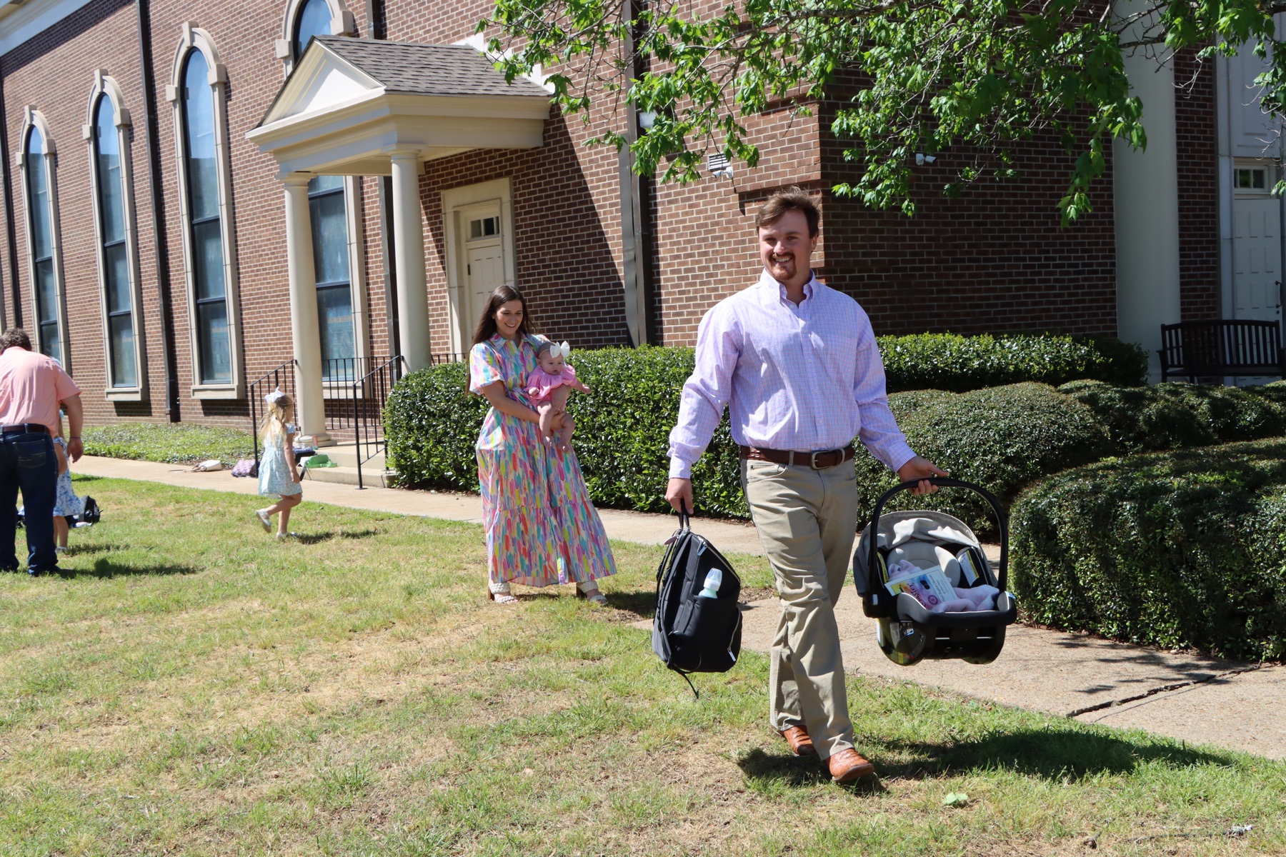 A young family leaving worship together